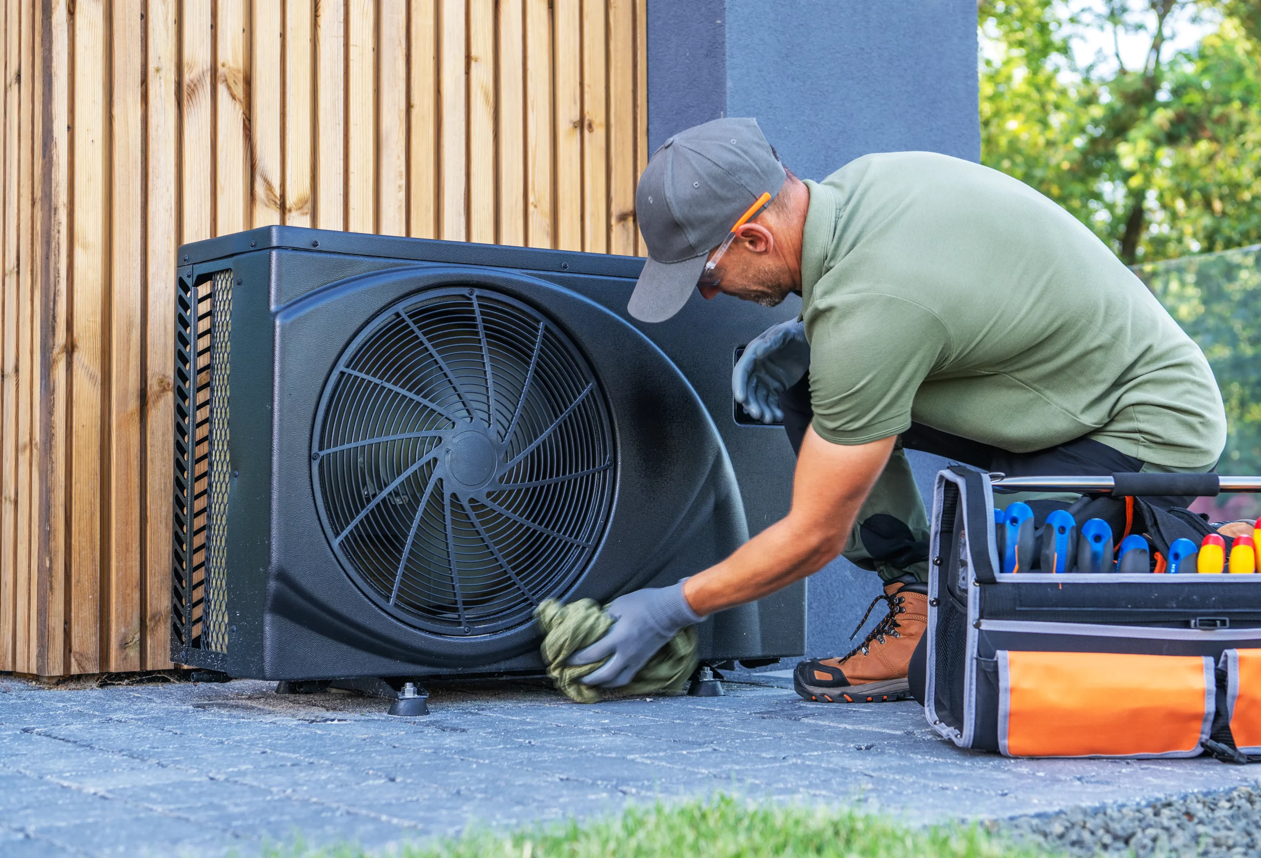 technician-performs-maintenance-on-outdoor-air-con-2025-01-31-16-26-16-utc